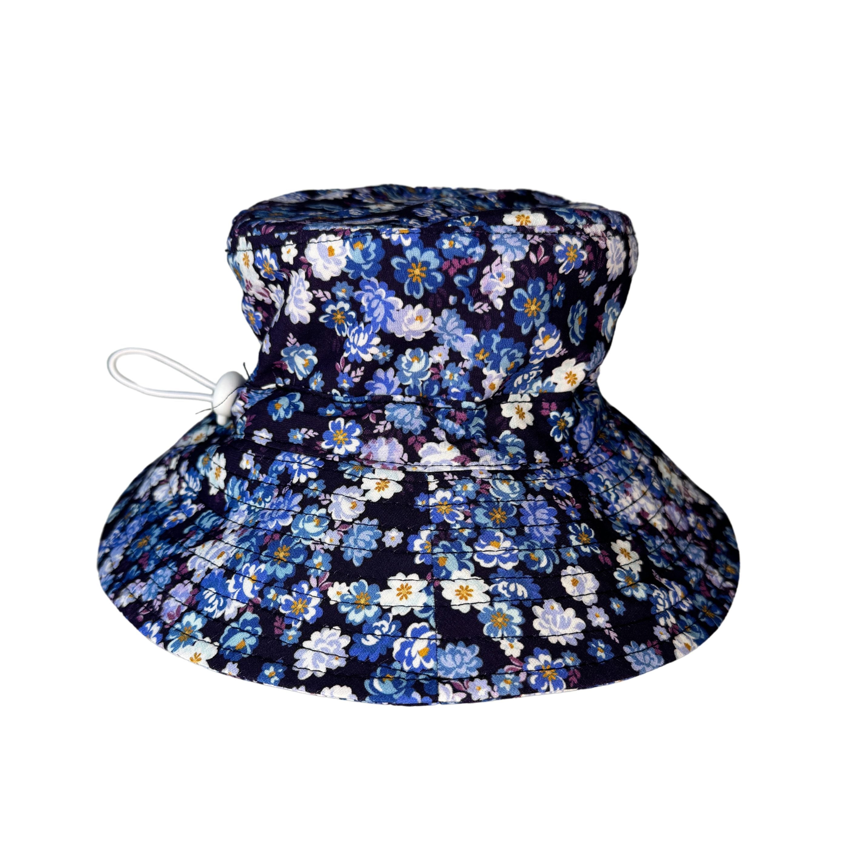 Girls Navy Floral Flowers Bucket Hat. Extra wide brim for sun protection. UPF50+ Adjustable strap.