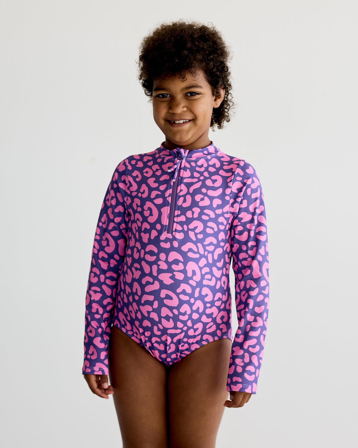 Pink Purple Safari Leopard print on purple long-sleeve kids swimwear swimming costume with UPF50+ sun protection and nylon fabric.