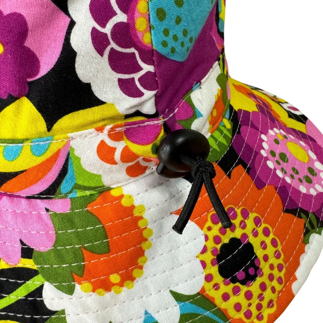 Girls Bright Floral Flowers Print Bucket Hat. Extra wide brim for sun protection. UPF50+ Adjustable strap.