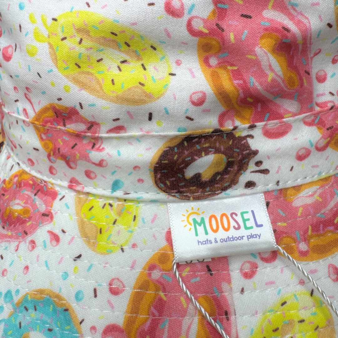 Kids Bright Fun Doughnuts Print Bucket Hat. Extra wide brim for sun protection. UPF50+ Adjustable strap.