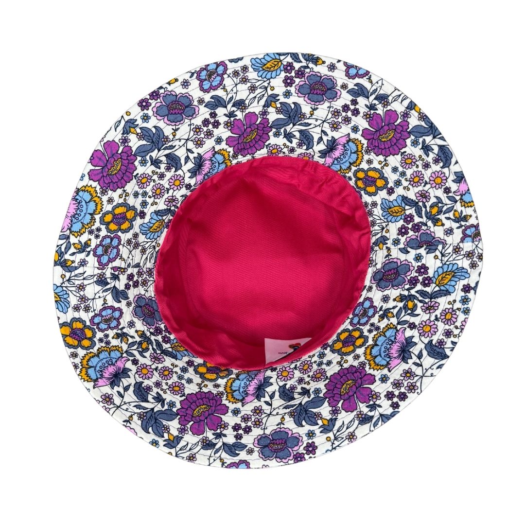Girls Purple Flowers Print Bucket Hat. Extra wide brim for sun protection. UPF50+ Adjustable strap for windy days.