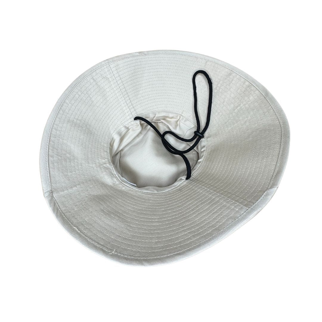 Women Ladies Beige Extra Cover Bucket Hat. Extra wide brim for sun protection. UPF50+ Adjustable strap. Bestselling ladies hat.