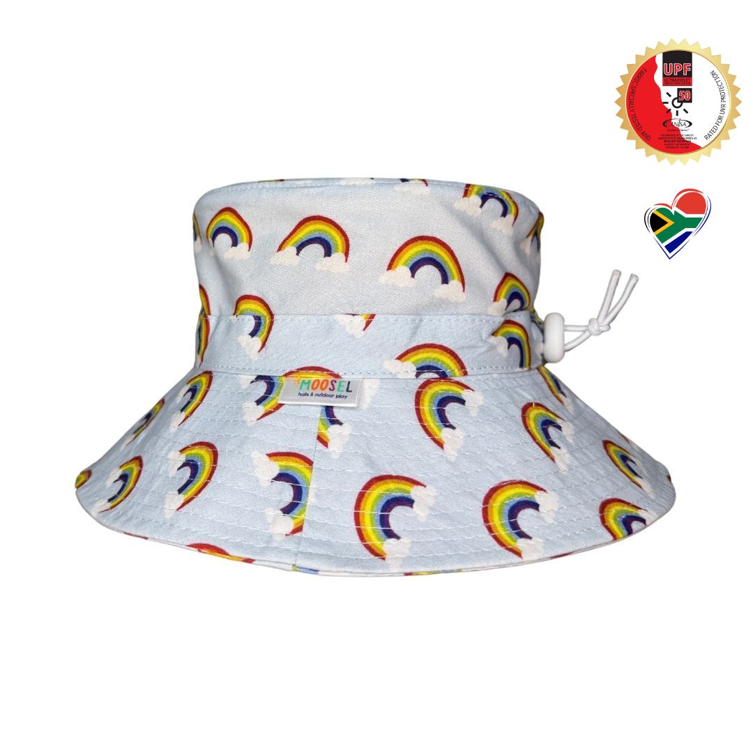 Baby Blue Fabric with rainbows clouds Print Bucket Hat. Extra wide brim for sun protection. UPF50+ Adjustable strap for windy days.