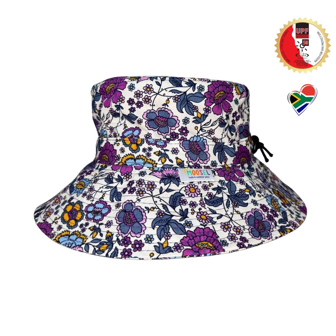Girls Purple Flowers Print Bucket Hat. Extra wide brim for sun protection. UPF50+ Adjustable strap for windy days.