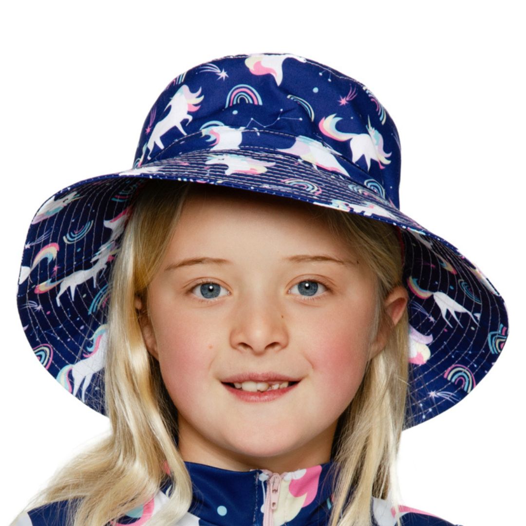 Girls Navy Purple Unicorns rainbows Print Bucket Hat. Extra wide brim for sun protection. UPF50+ Adjustable strap.