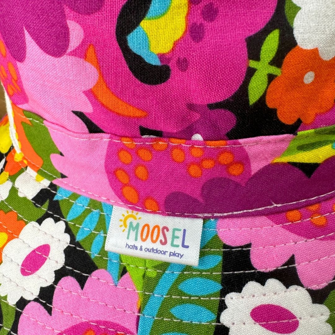 Girls Bright Floral Flowers Print Bucket Hat. Extra wide brim for sun protection. UPF50+ Adjustable strap. 